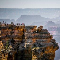 A group of people on a cliff
Description automatically generated with medium confidence