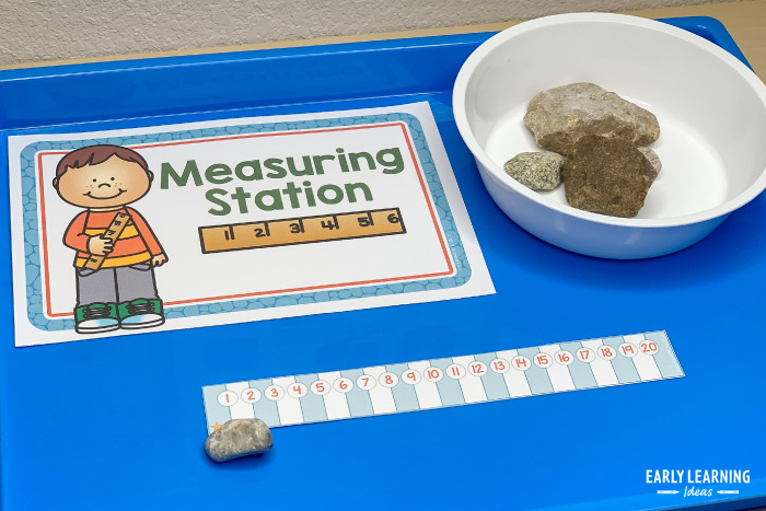 measure rocks in dramatic play center