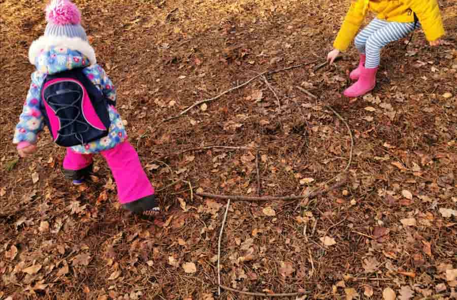 kids making a stick maze