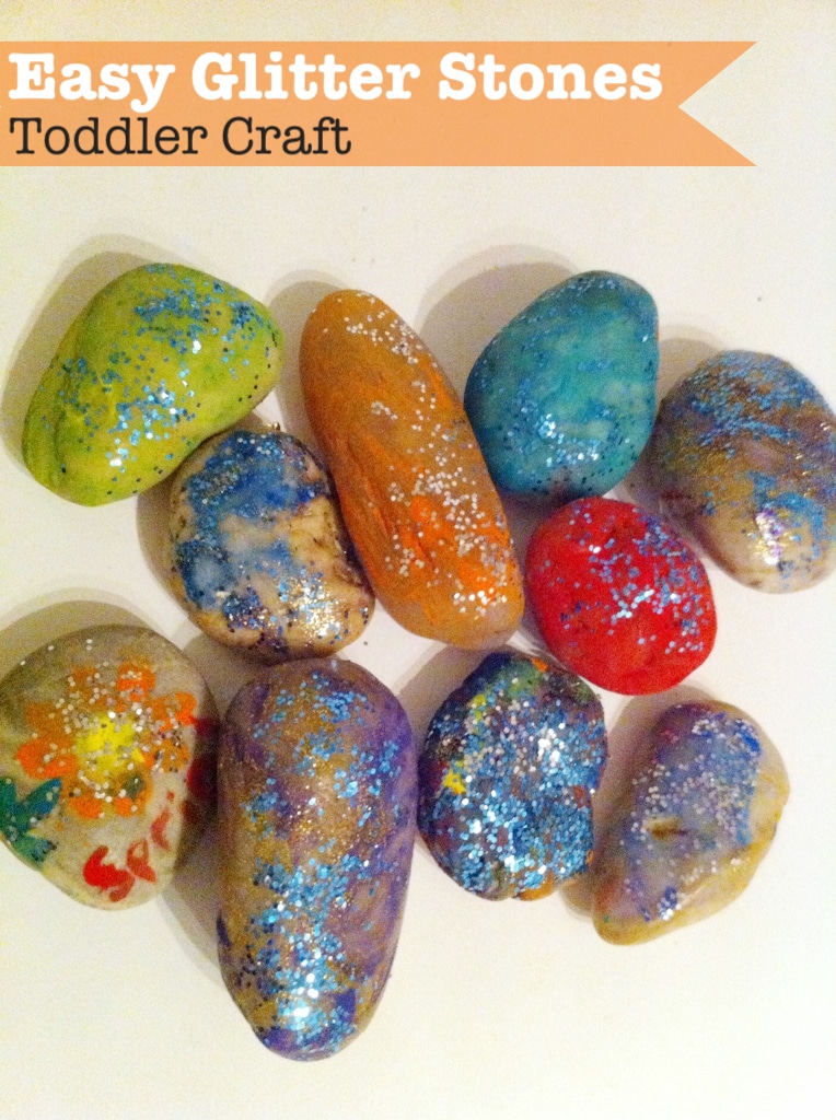 Painting rocks to make easy glitter stones. This toddler craft is so easy and could be adapted for Fathers day!