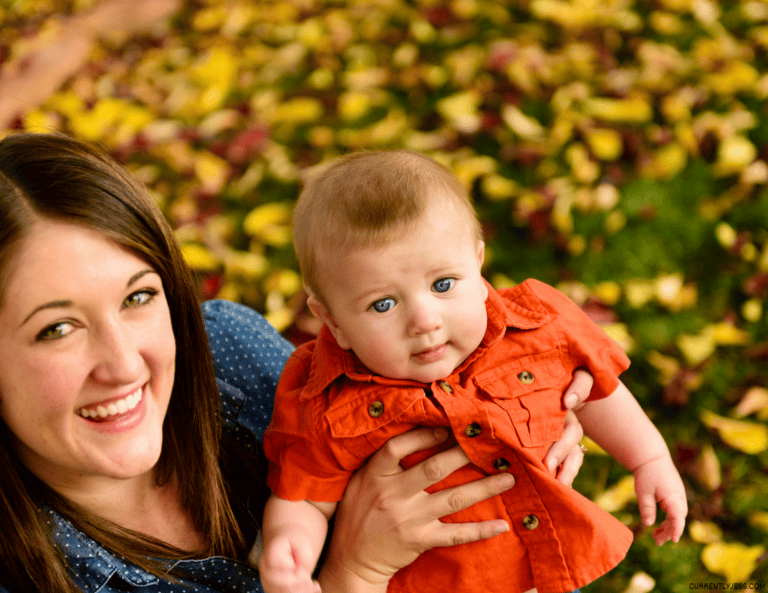 Baby dressed up for a fall photo shoot to remember their first fall.