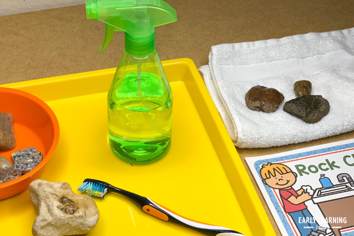 clean and identify rocks in a preschool dramatic play geology lab