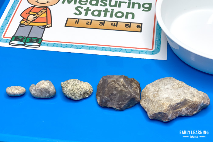compare size of rocks in science dramatic play center for preschoolers