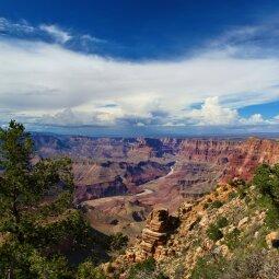 A picture containing sky, valley, outdoor, canyon
Description automatically generated