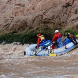 A group of people in a raft
Description automatically generated with medium confidence