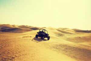 A quadbike driving through the desert.