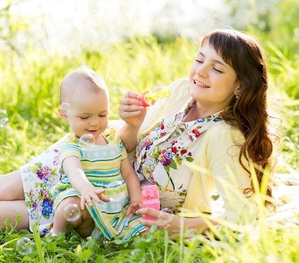 A picture containing outdoor, person, grass, baby

Description automatically generated