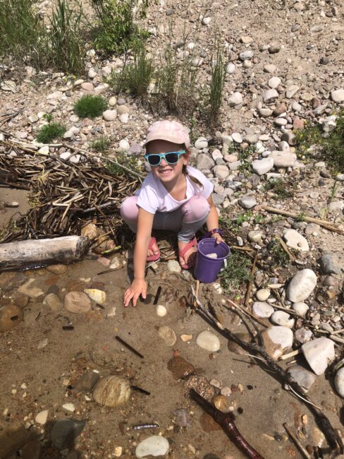 Kids out finding new rocks to add to their nature collections.