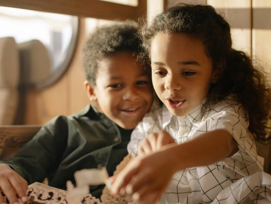 two kids reading a fairy tale book