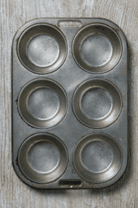 A muffin tin to use as a mold for playing with ice