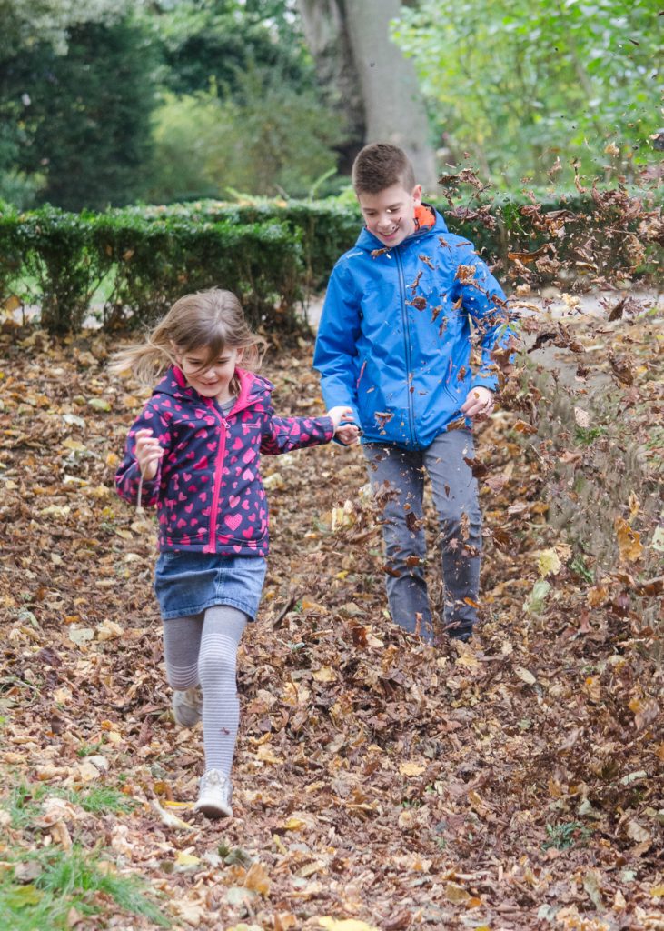 nature play - running through autumn leaves