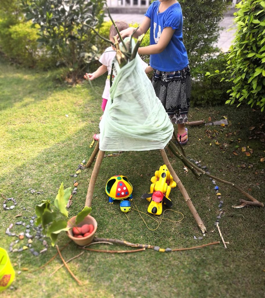 build a teepee-loose parts