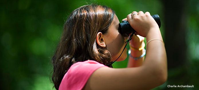 Girl using binoculaurs