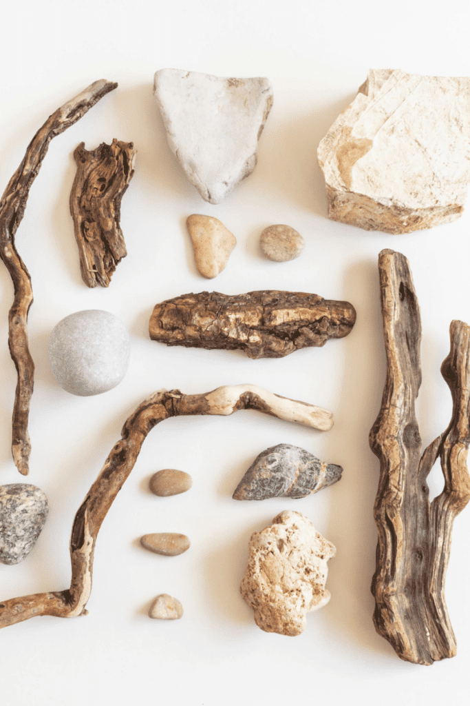 Stones and drift wood for loose parts play for children.