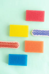 sponges and scrub brushes that can be frozen or used to scrub ice in playing with ice activities