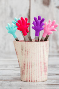 metal and silicone tongs for toddlers to use to pick up cubes while playing with ice