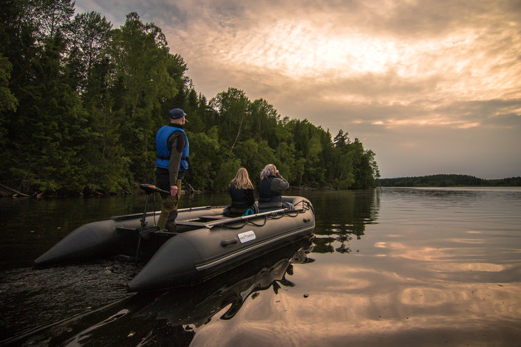 In search of beavers using a rubber boat with a silent electric motor. Photo: Simon Green