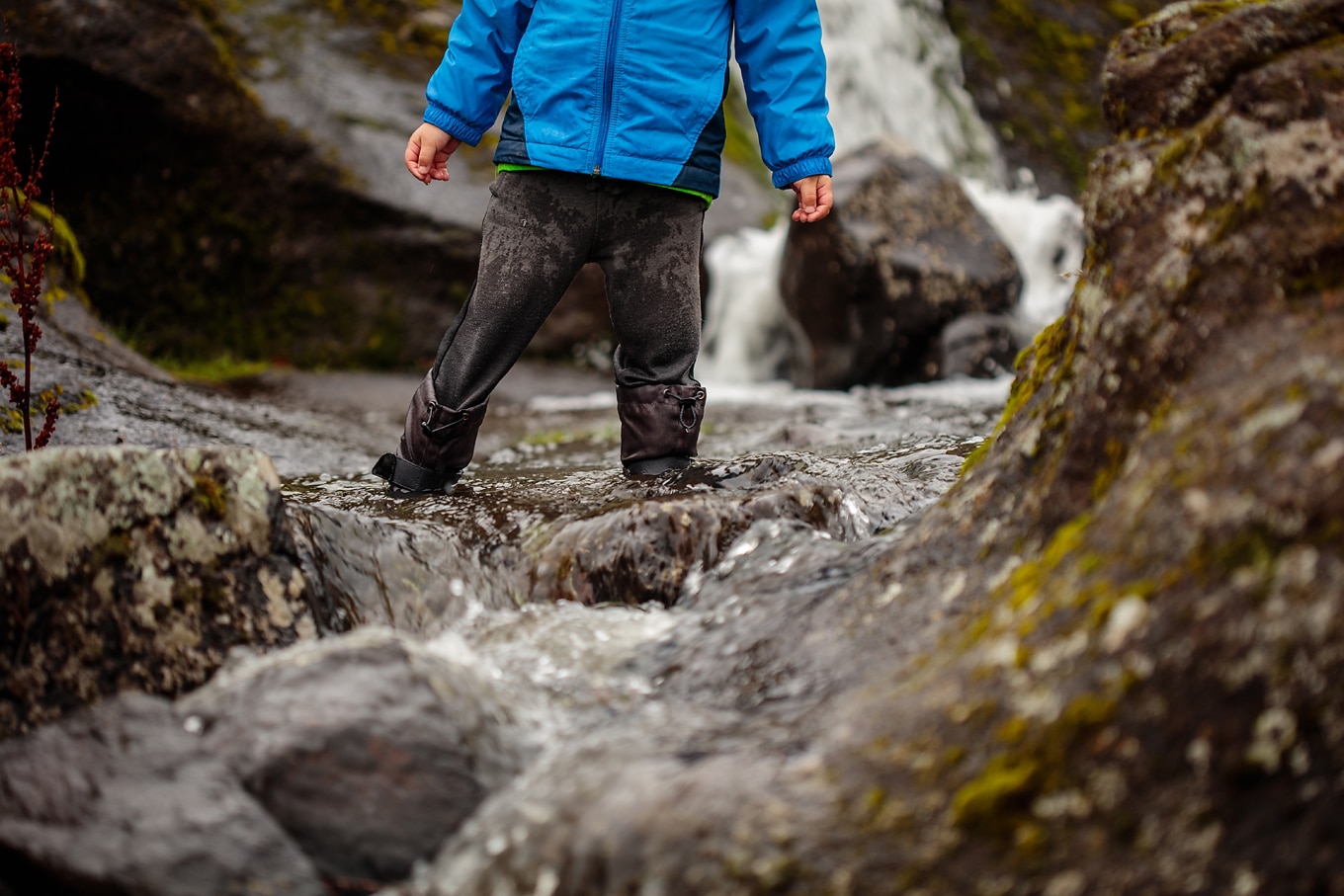 Child Playing in Creek on Nature Walk