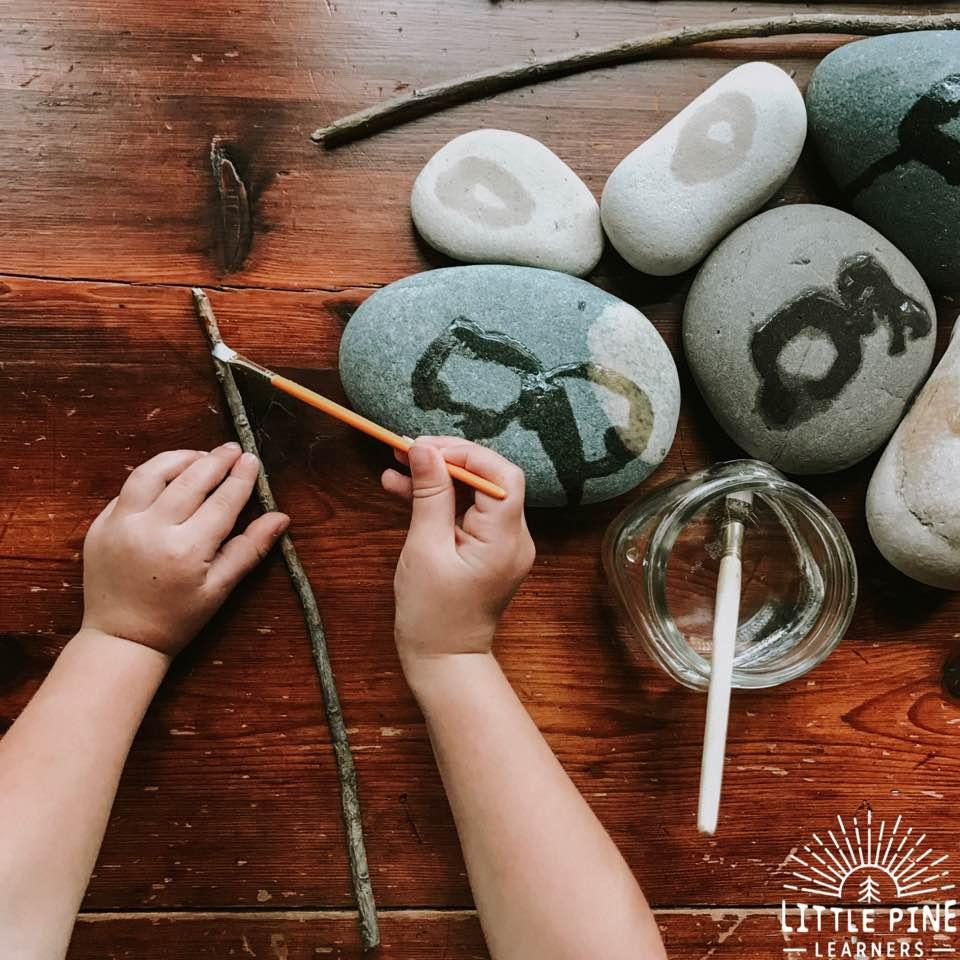 Paint on sticks and stones with water