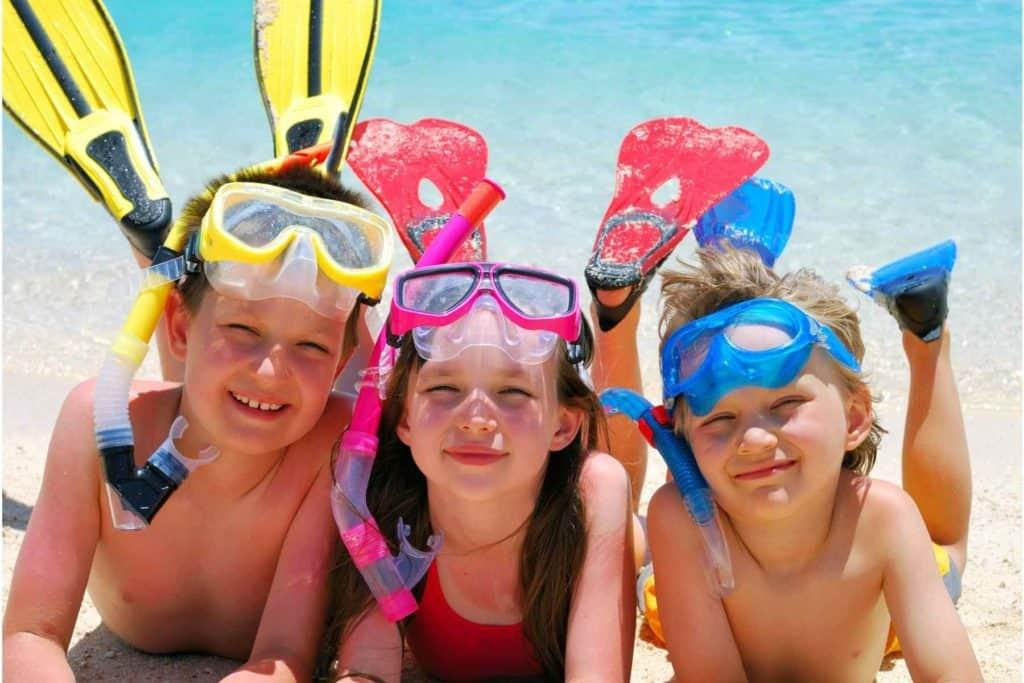 A group of girls wearing swim caps and goggles in a pool

Description automatically generated with low confidence